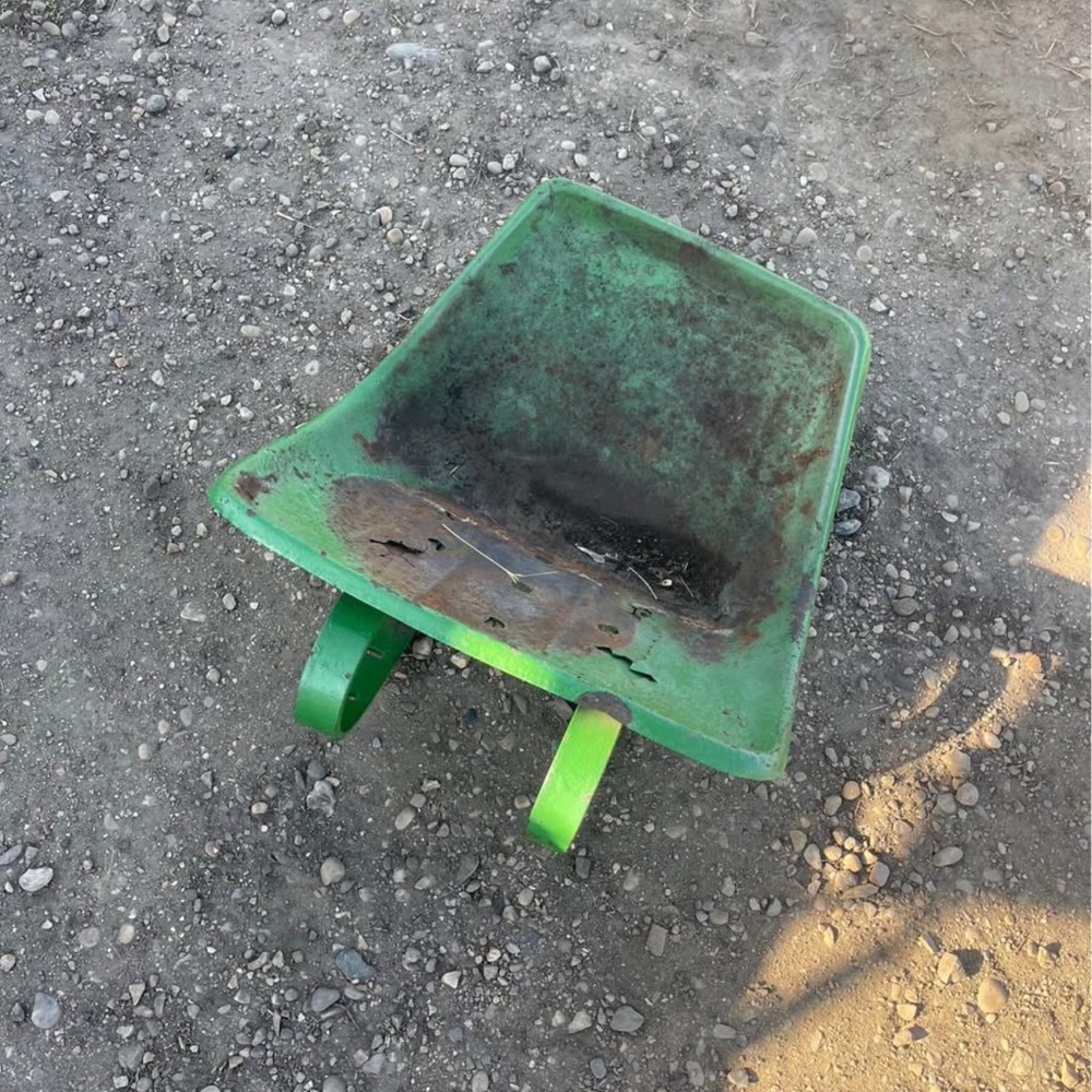 Vintage seat pan from a John Deere 110 lawn and garden tractor - late 1960